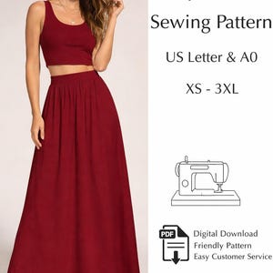 May include: A woman wearing a burgundy crop top and maxi skirt. The image includes text that reads "Boho Crop Top & Skirt Sewing Pattern" and "XS - 3XL". A sewing machine illustration and PDF download icon are also present.