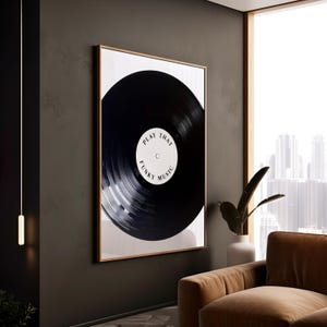 May include: A black and white print of a vinyl record with the text "Play That Funky Music" on the label.