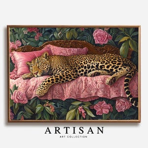 May include: A framed artwork featuring a leopard resting on a pink bed with floral accents. The leopard has a spotted coat and is lying down. The bed has a pink pillow and is surrounded by pink roses and green foliage. The text "ARTISAN ART COLLECTION" is at the bottom.