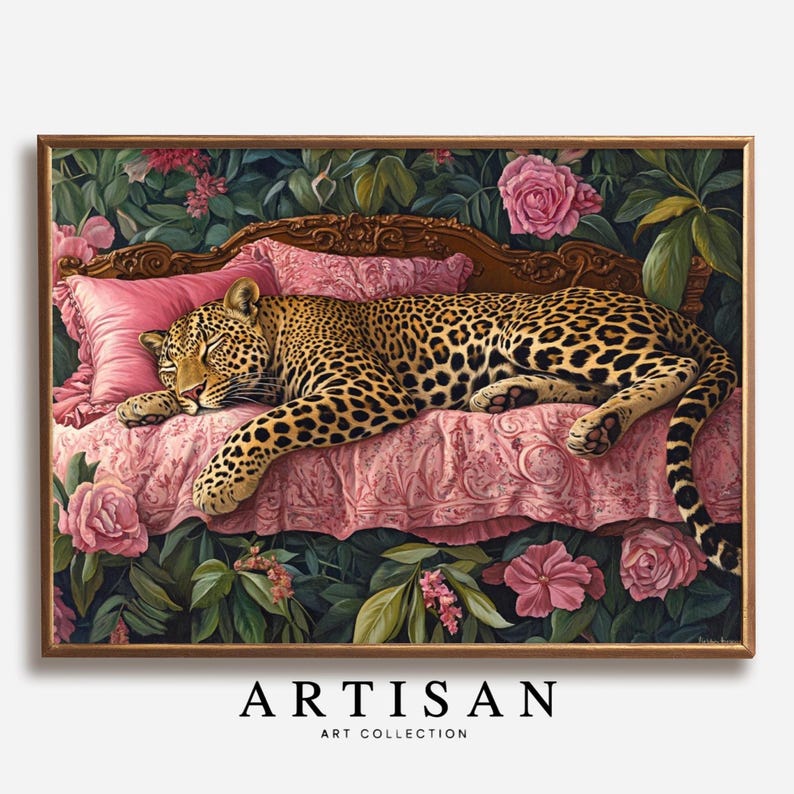 May include: A framed artwork featuring a leopard resting on a pink bed with floral accents. The leopard has a spotted coat and is lying down. The bed has a pink pillow and is surrounded by pink roses and green foliage. The text "ARTISAN ART COLLECTION" is at the bottom.