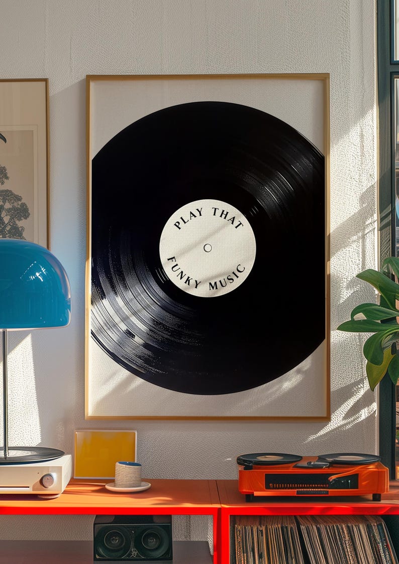May include: A framed print of a black vinyl record with the text "Play That Funky Music" in white.