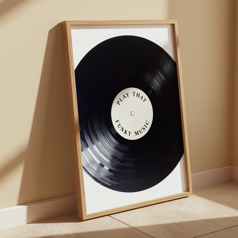 May include: A framed print of a black vinyl record with the text "Play That Funky Music" in white.