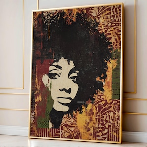 May include: Framed art print featuring a striking black and white portrait of a woman with a large afro. The background has a textured, multi-colored design with red, green, and gold tones. The artwork is encased in a gold frame.