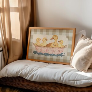 Whimsical illustration of a mother duck with four fluffy ducklings sitting together in a vintage pink floral teacup, placed against a soft beige textured background layered on top of a brown gingham pattern.
Duck wall art cute duck art kids room decor bathroom wall decor duck lover gift baby shower gift kids bathroom decor cute duck print trendy wall art printable wall art beige plaid gingham print cottagecore decor digital download duck nursery print vintage duck art beige gingham nursery.