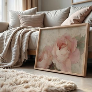 A beautifully textured oil painting of soft blush pink roses against a muted beige background. The brushstrokes create a rich depth and realism, while the pastel tones and gentle blending give the painting a romantic and dreamy feel. The artwork has an impressionistic style, perfect for adding an elegant and timeless floral touch to any space.
This artwork is a close-up of a delicately textured oil painting featuring soft pink roses.