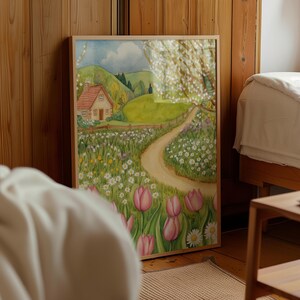 Watercolor illustration of a spring cottage meadow with pink tulips, white daisies, a winding path, and a small countryside house under blooming trees in cottagecore style. Spring landscape farmhouse decor cozy cottage printable wall art cottage decor cozy home decor spring flowers digital download pink tulip wall art tulip wall decor.