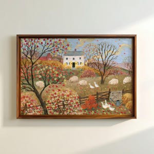 Peut inclure: Une peinture de paysage encadrée représentant une ferme blanche avec une grange rouge au loin. La scène montre des arbres d'automne aux feuilles rouges et jaunes, un troupeau de moutons blancs, trois oies blanches, des citrouilles et un arrosoir bleu.