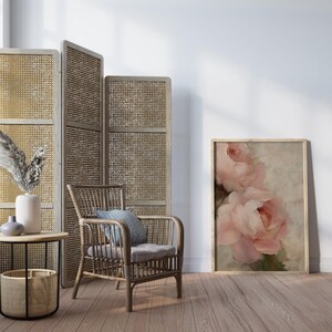 A beautifully textured oil painting of soft blush pink roses against a muted beige background. The brushstrokes create a rich depth and realism, while the pastel tones and gentle blending give the painting a romantic and dreamy feel. The artwork has an impressionistic style, perfect for adding an elegant and timeless floral touch to any space.
This artwork is a close-up of a delicately textured oil painting featuring soft pink roses.