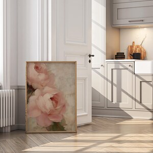A beautifully textured oil painting of soft blush pink roses against a muted beige background. The brushstrokes create a rich depth and realism, while the pastel tones and gentle blending give the painting a romantic and dreamy feel. The artwork has an impressionistic style, perfect for adding an elegant and timeless floral touch to any space.
This artwork is a close-up of a delicately textured oil painting featuring soft pink roses.