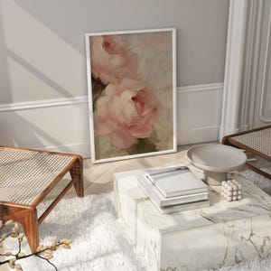 A beautifully textured oil painting of soft blush pink roses against a muted beige background. The brushstrokes create a rich depth and realism, while the pastel tones and gentle blending give the painting a romantic and dreamy feel. The artwork has an impressionistic style, perfect for adding an elegant and timeless floral touch to any space.
This artwork is a close-up of a delicately textured oil painting featuring soft pink roses.