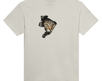 May include: A light grey t-shirt featuring a graphic of a cat's face peering out of a hole in the fabric.
