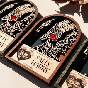 May include: Wooden map art featuring a laser-cut city map with a red heart marking a location. The art includes a photo and the text "WHERE IT ALL BEGAN", "SALLY HARRY", and "JUNE 20, 1977".