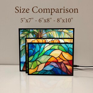 May include: Three stained glass panels with black frames, displaying vivid colours and abstract designs. Sizes are 5"x7" (12.7cm x 17.8cm), 6"x8" (15.2cm x 20.3cm), and 8"x10" (20.3cm x 25.4cm). The text reads "Size Comparison".