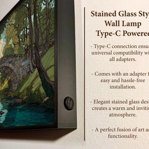 May include: A rectangular wall lamp with a stained glass style design, depicting a landscape scene with a bridge over a river. The lamp is Type-C powered and has a black frame. Text on the side reads "Stained Glass Style Wall Lamp Type-C Powered."