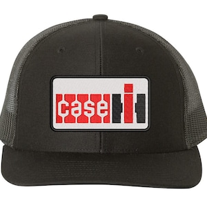 May include: Black and red Case IH logo embroidered on a black trucker hat with a black mesh back.