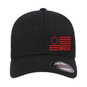 May include: Black baseball cap with a red embroidered American flag and the text "MAGA".
