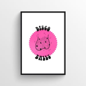 May include: A pink and black illustration of a pair of disco balls with the text "DISCO BALLS" in a retro font.