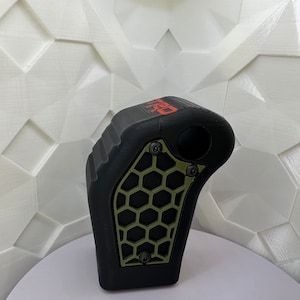 May include: Black and green gear shift knob with a honeycomb pattern and the word "PRO" printed in red.