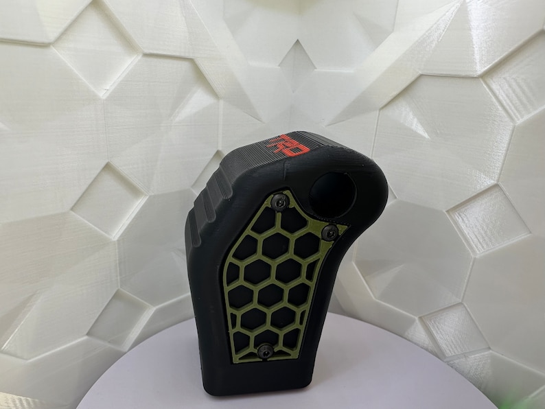 May include: Black and green gear shift knob with a honeycomb pattern and the word "PRO" printed in red.