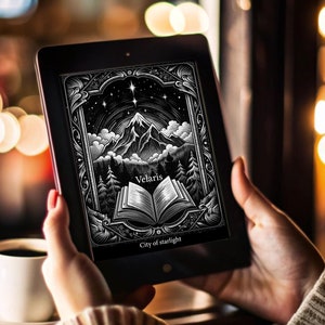May include: A person is reading a digital book on a tablet. The book cover features a black and white illustration of a mountain range with a book open in the foreground. The text on the cover reads "Velaris, City of Starlight".
