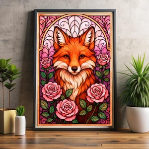 May include: A framed art print depicting a fox with orange and white fur, set against a stained-glass style background of pink and purple. Pink roses and green leaves surround the fox. The artwork is displayed on a wooden surface.