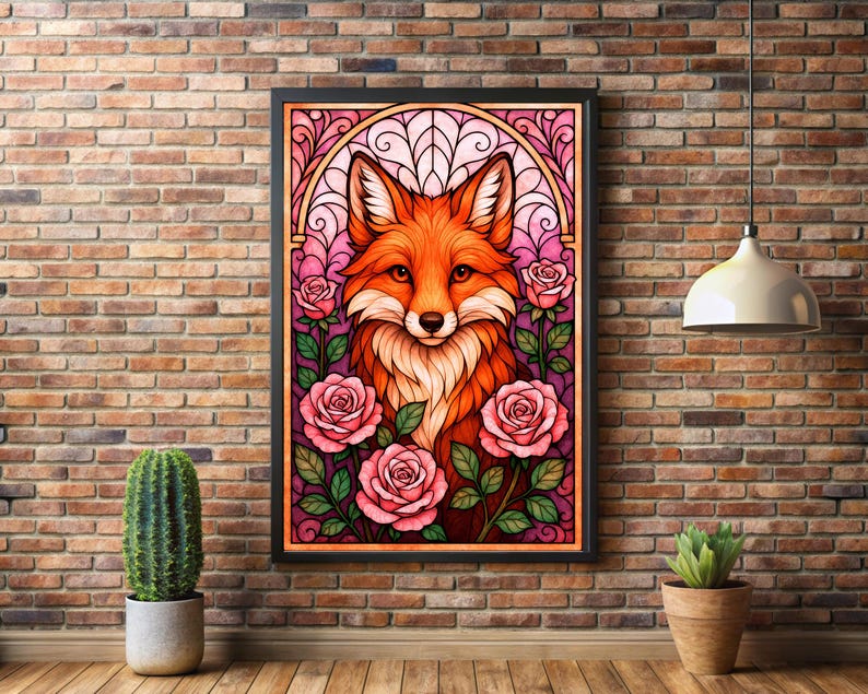 May include: A framed art print depicting a fox with orange and white fur, framed by pink roses and green leaves. The artwork has a stained-glass effect and a black frame. The print is displayed against a brick wall.