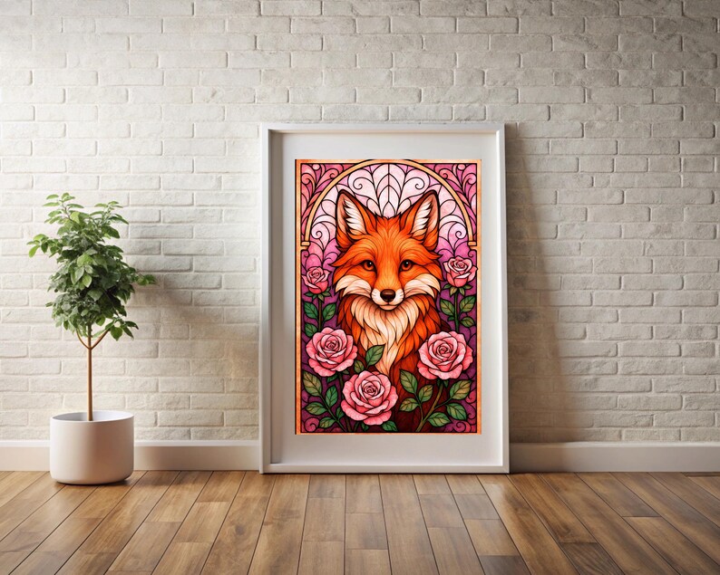 May include: A framed art print depicting a fox with orange and white fur, set amongst pink roses. The artwork has a stained-glass style, with a decorative arch above the fox. The frame is white, and the background is a white brick wall.
