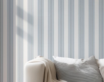 May include: Wallpaper featuring a repeating pattern of vertical stripes in varying shades of light blue, slate gray, and white. The design consists of thin and thick lines arranged in a symmetrical sequence across the entire surface area.