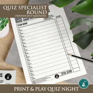 May include: A black and white quiz sheet with the text "QUIZ SPECIALIST ROUND" and "PRINT & PLAY QUIZ NIGHT". The sheet includes spaces for answers and a score section. A pencil rests on the sheet.