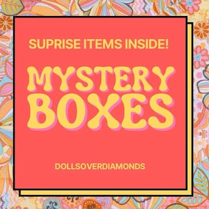 May include: A pink and yellow graphic with the text "SUPRISE ITEMS INSIDE! MYSTERY BOXES" and the text "DOLLSOVERDIAMONDS" in a white font on a pink background.
