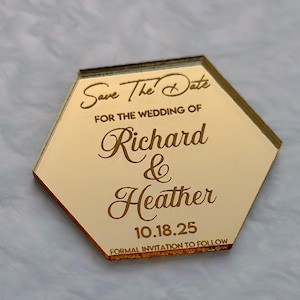 May include: A gold-colored, hexagonal 'Save The Date' announcement. The text includes the names 'Richard & Heather' and the date '10.18.25'. The bottom of the announcement reads 'Formal Invitation to Follow'.