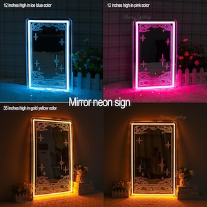 K&ouml;nnte beinhalten: Neon-Spiegelschilder in Eisblau, Pink und Goldgelb. Die Schilder sind rechteckig mit einem Tarotkarten-Design, das Sterne und Wolken zeigt. Die eisblauen und rosa Schilder sind 30 cm hoch, w&auml;hrend das goldgelbe Schild 89 cm hoch ist.