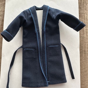 May include: A dark blue robe with a blue trim and a tie belt.