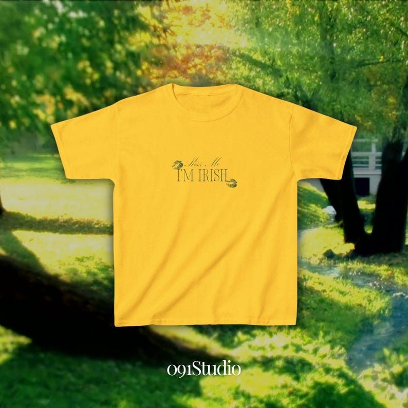 May include: A yellow t-shirt with the text "Kiss Me I'm Irish" and a shamrock design.