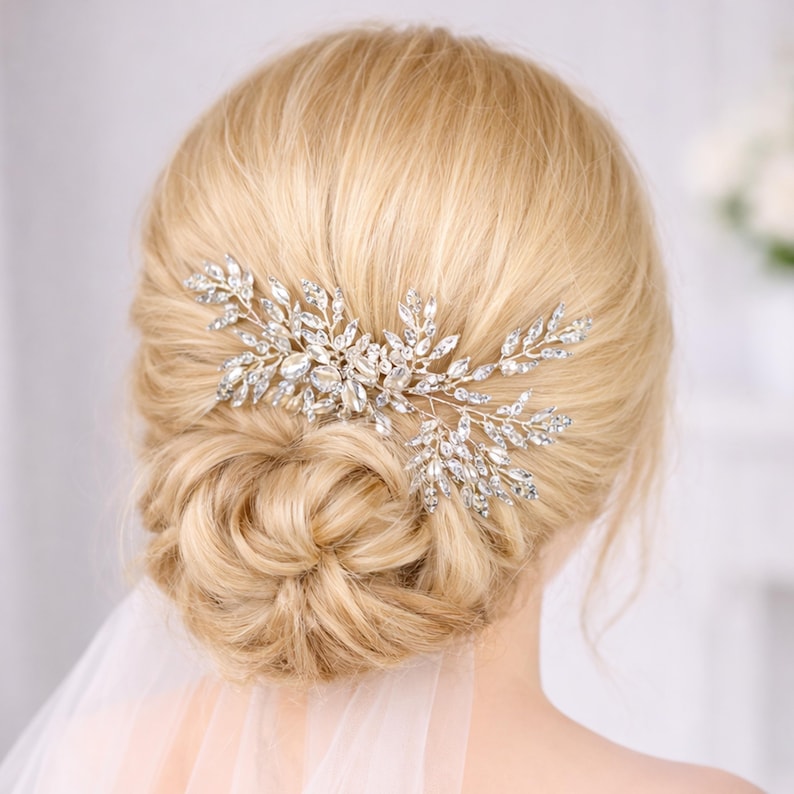 A close-up view of a woman's blonde hair with a decorative hair accessory featuring small, sparkling crystals.