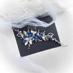 a bridal hair comb with blue flowers and leaves