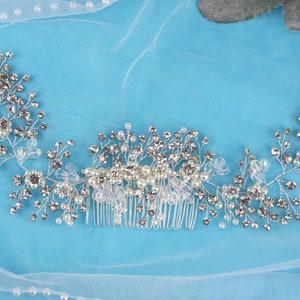 a close up of a hair comb on a blue cloth