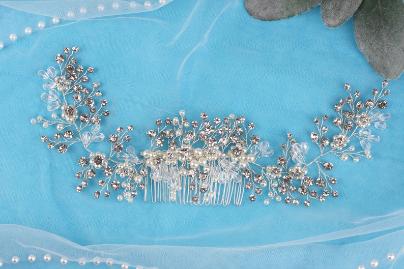 a close up of a hair comb on a blue cloth