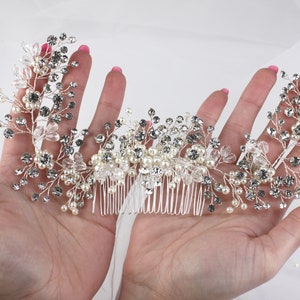 a woman's hand holding a bridal hair comb