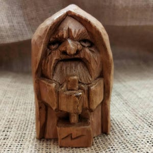 Thor statue. Handmade wooden statue of the god Thor. Wood carving.