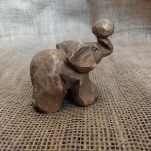 Wooden Elephant Figurine, a sweet hand-carved lucky charm.