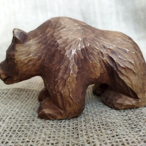 Bear statue. Handmade forest animal. Wildlife sculpture.