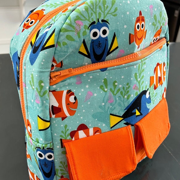 Finding Nemo Backpack.  This one of a kind, handmade backpack is compact yet large enough to carry your essentials for a day in the parks.