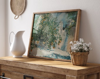Puede incluir: Una pintura al agua enmarcada de un huerto de cítricos con un edificio blanco en el fondo. La pintura está colgada en una pared blanca sobre una cómoda de madera con una jarra blanca y una pequeña planta en maceta.