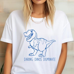 Divertente maglietta da boxe T-Rex, maglietta con dinosauri dinamici che dominano la mascotte della scuola superiore, canzone di combattimento, umorismo sui dinosauri, regalo, gioco di parole preistorico