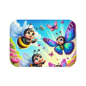 May include: A whimsical illustration features cartoon bees and butterflies in a vibrant, sunny scene. The characters have large eyes and are surrounded by colorful flowers and a bright blue sky. The artwork has a cheerful, playful aesthetic.