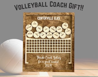 May include: A wooden sign with a volleyball net design and the text "CENTERVILLE ELKS" at the top. The sign has a brown background and is decorated with white volleyball-shaped pieces with names written on them. The text "Thanks Coach Sidney for a great season! 2024" is written at the bottom of the sign.
