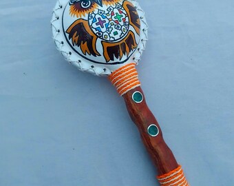 shamanic leather rattle with handmade painting in blood stick and crystal quartz