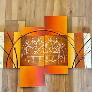 May include: A four-panel wall art set featuring a stylized white line drawing of the Last Supper centered across the two middle panels. The background consists of gradient shades of orange, yellow, and cream with black and orange curved lines.