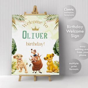 May include: A rectangular birthday welcome sign featuring the text Welcome To OLIVER birthday! with a gold crown icon. The design includes illustrations of a lion cub, a warthog, and a meerkat, framed by green tropical palm leaves on a light background.